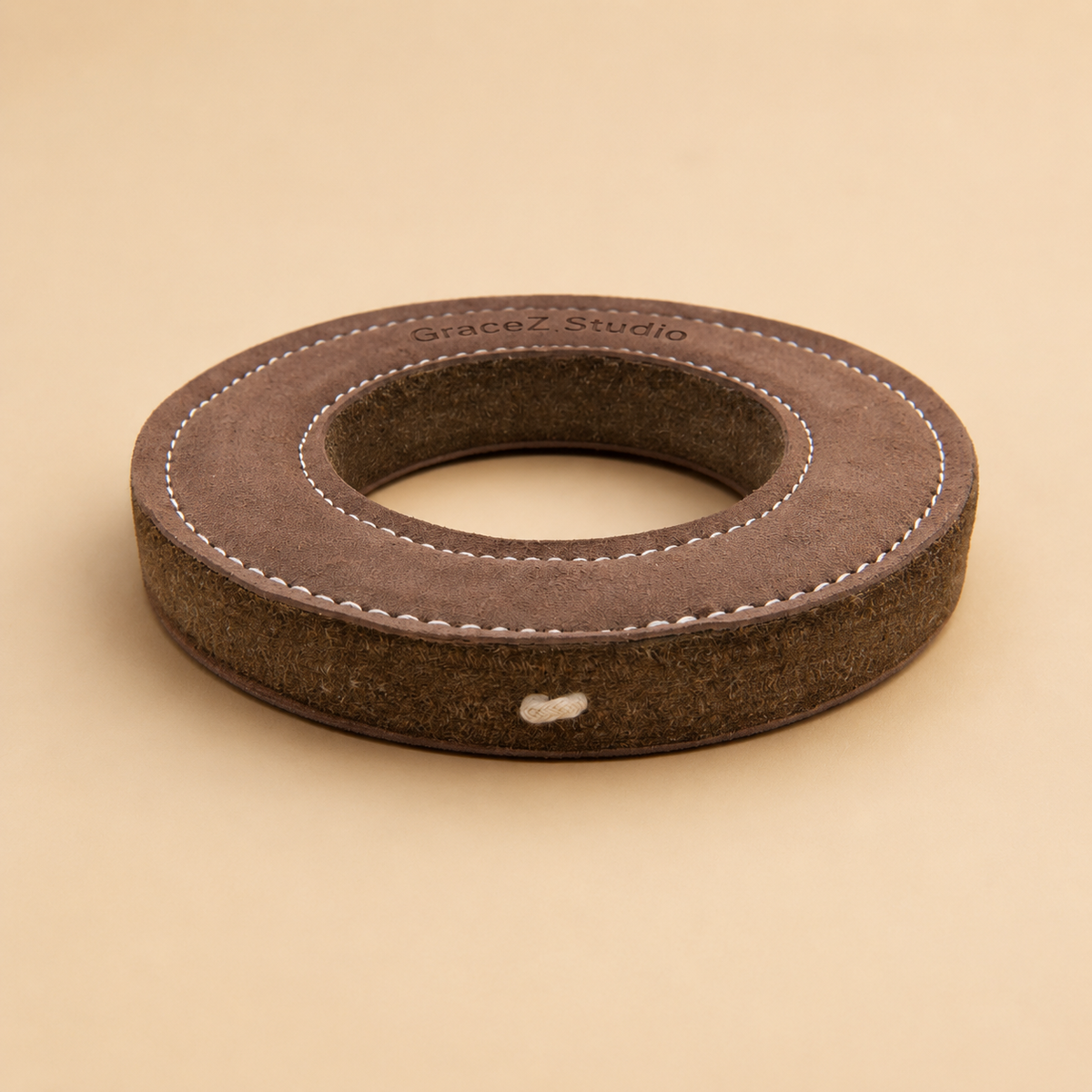 Suede leather dog flying ring with abrasion-resistant wool felt edge and small hanging loop