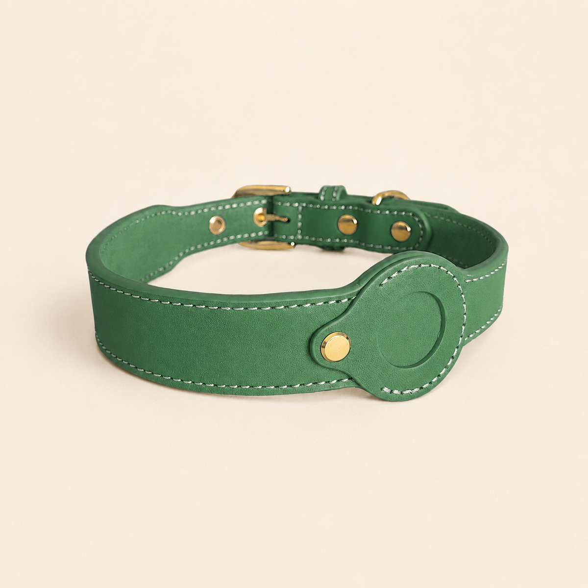 green dog collar showing the removable leather AirTag holder without an AirTag installed