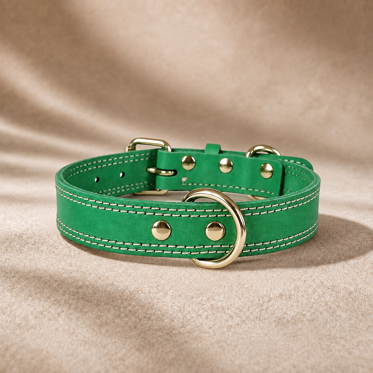 green full-grain leather dog collar with dual D-rings, brown stitching and polished gold-tone hardware.