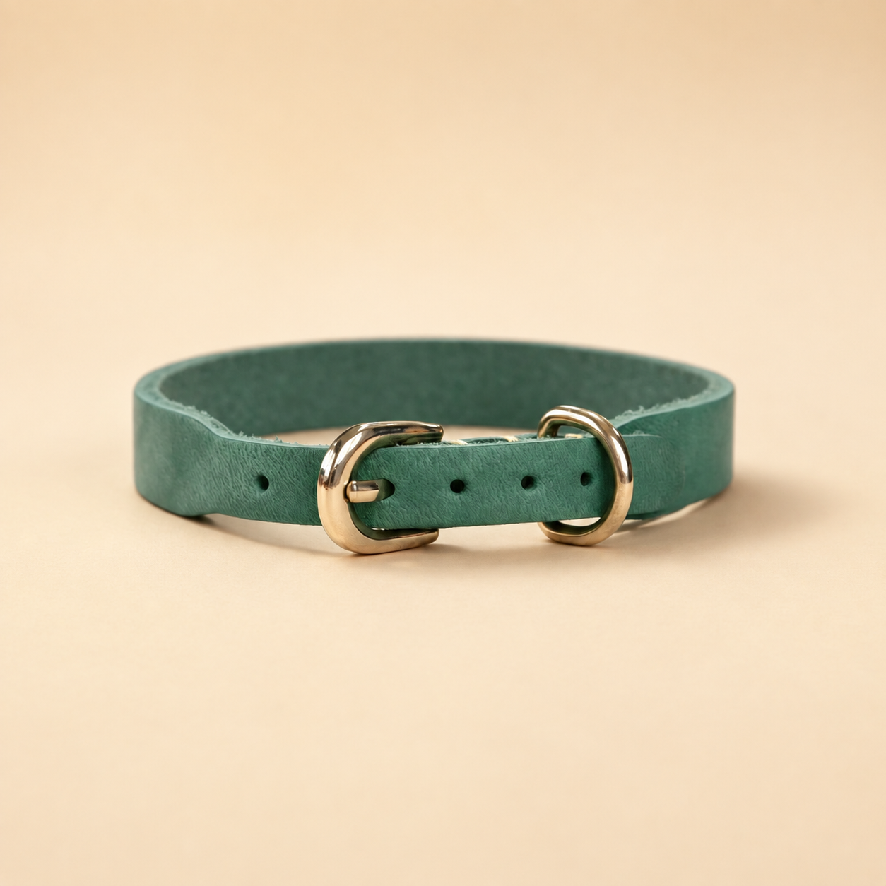 Green full-grain leather dog collar with adjustable buckle holes and pale-gold D-ring
