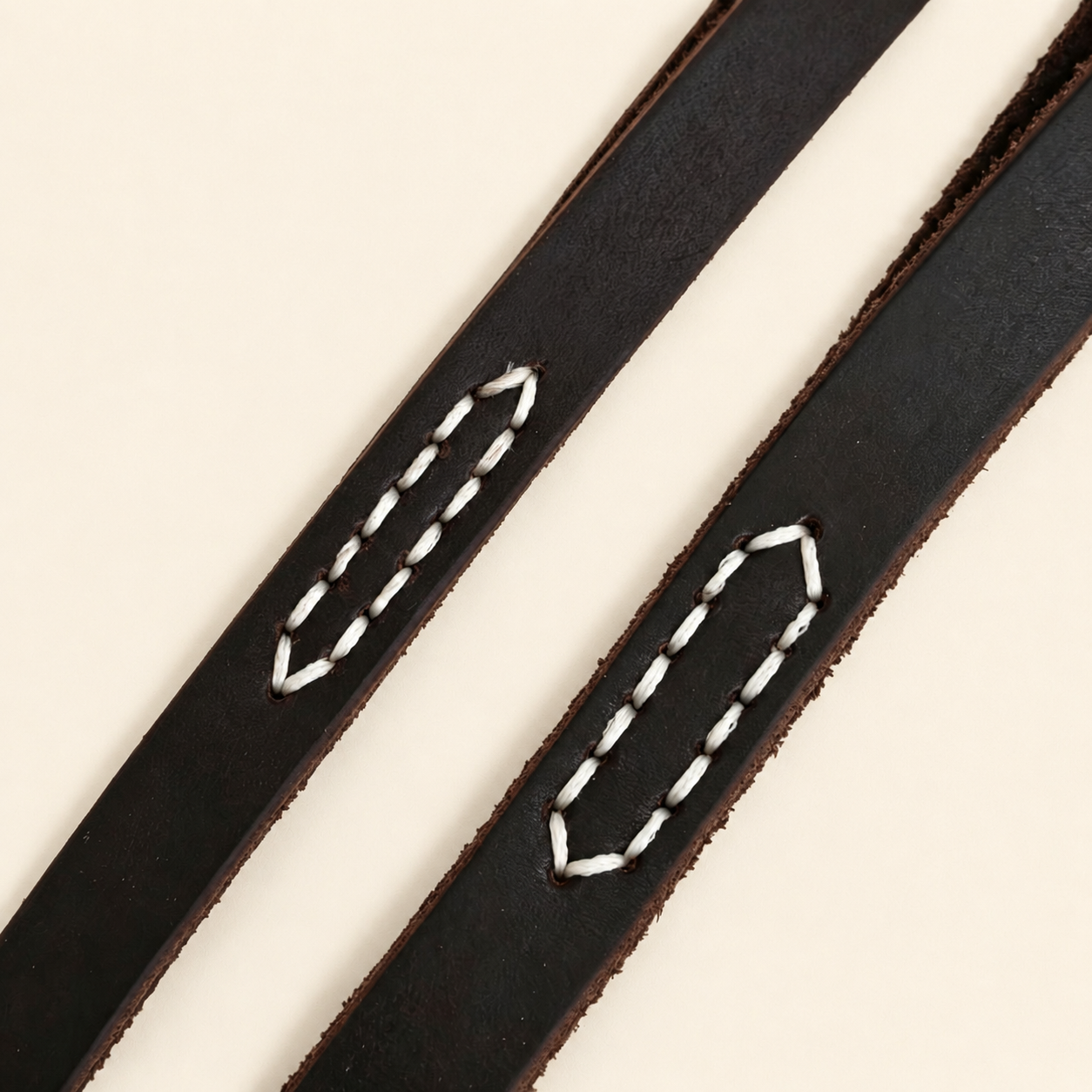 Close-up of dark chocolate leather slip lead reinforced with hand-stitched waxed thread