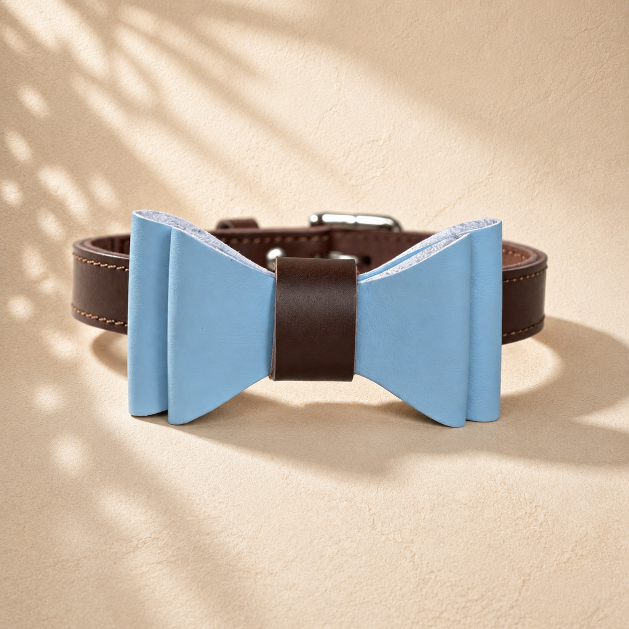 Brown full-grain leather dog collar with a detachable light blue microfibre bow tie.