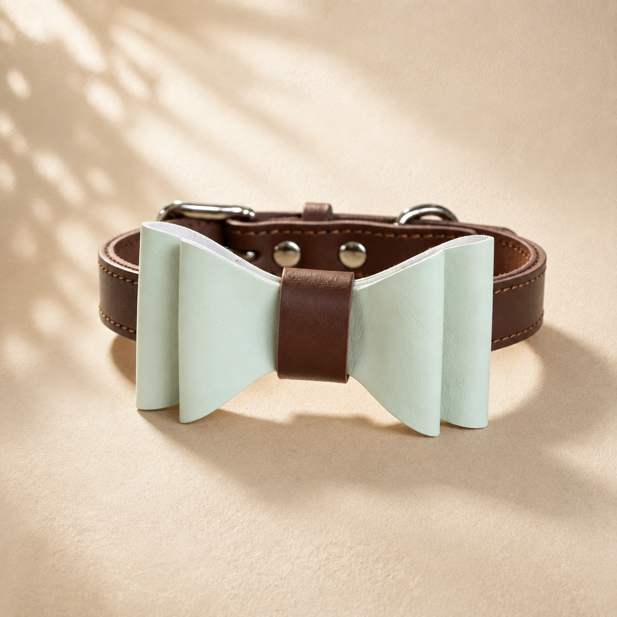 Brown full-grain leather dog collar with a detachable mint green microfibre bow tie.