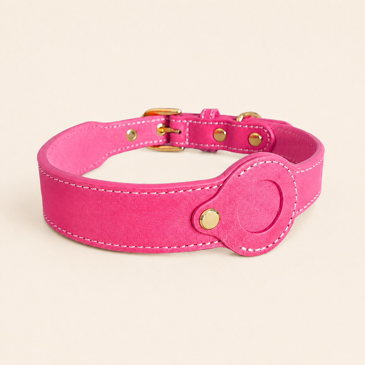 Pink dog collar showing the removable leather AirTag holder without an AirTag installed
