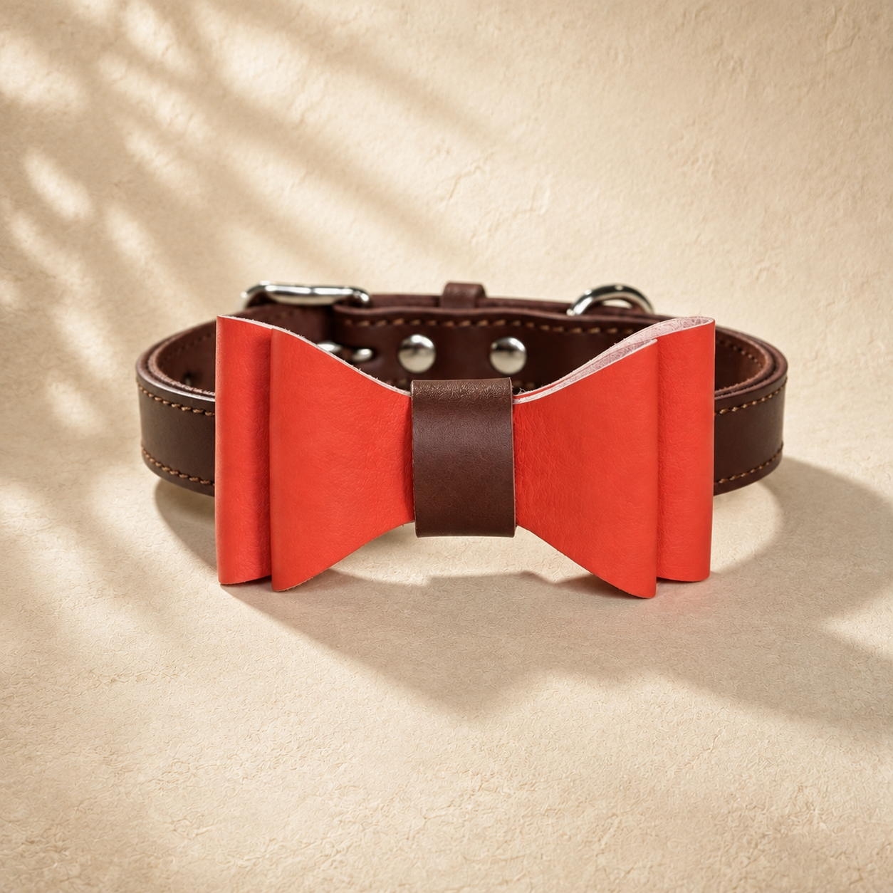 Brown full-grain leather dog collar with a detachable red microfibre bow tie.