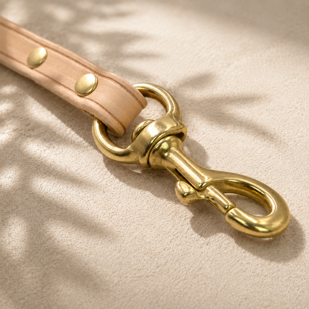 Solid brass swivel clip on a natural vegetable-tanned leather dog leash